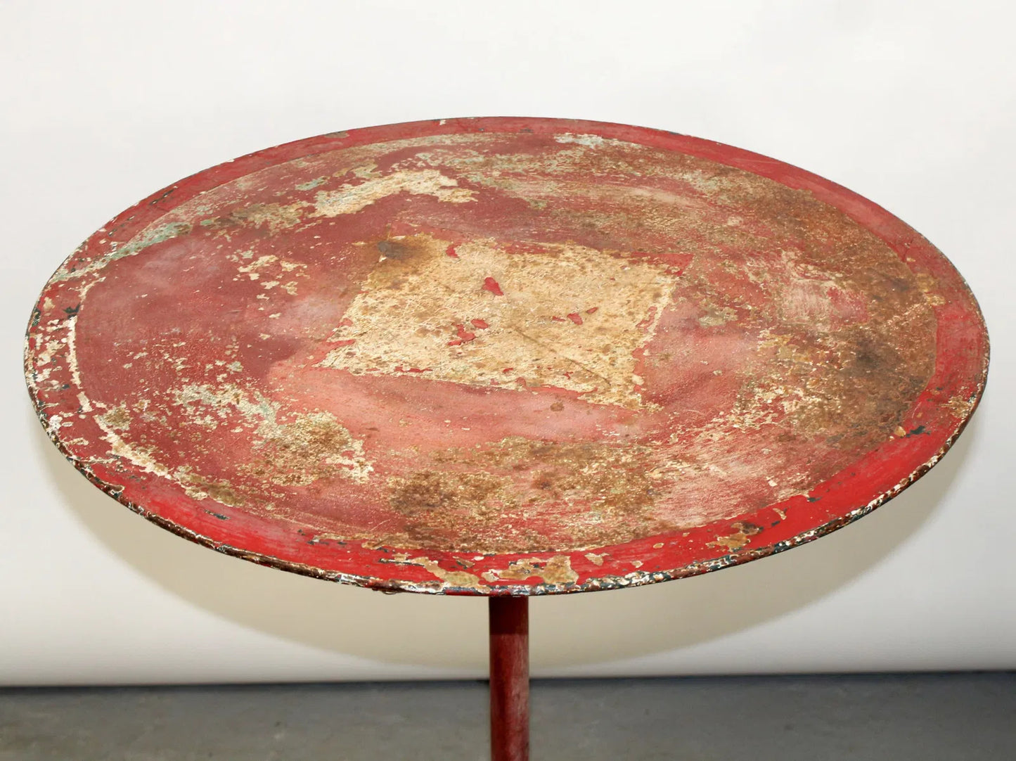 French painted red metal gueridon garden table, c 1910