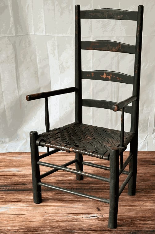 Early 19th Century Early American Ladder Back Arm Chair in Old Black Paint